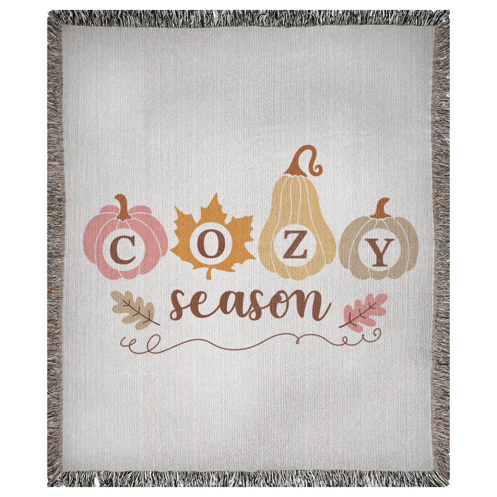 A 50x60 inch woven blanket depicting bohemian-style pumpkins. It says "cozy season".