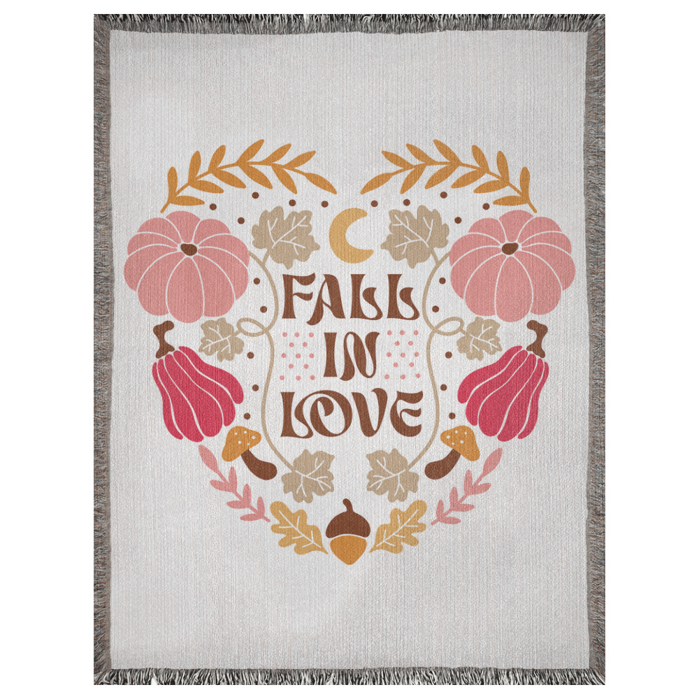 A 60x80 inch woven blanket depicting bohemian-style pumpkins, acorns, leaves, and a moon. It says "fall in love".