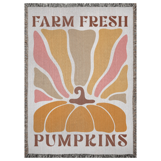 A 37x52 inch woven blanket depicting a bohemian-style pumpkin. It says "farm fresh pumpkins".