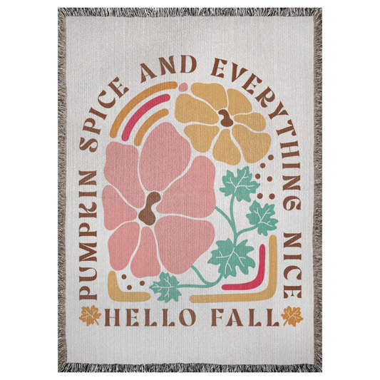 A 37x52 inch woven blanket depicting bohemian-style flowers. It says "pumpkin spice and everything nice, hello fall".