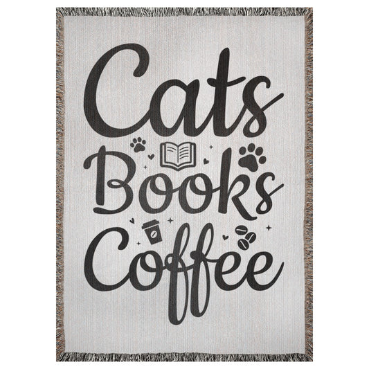 A 37x52 inch woven blanket with the words "cats", "books", "coffee". It has icons of coffee beans, paw prints, hearts, and a book. 