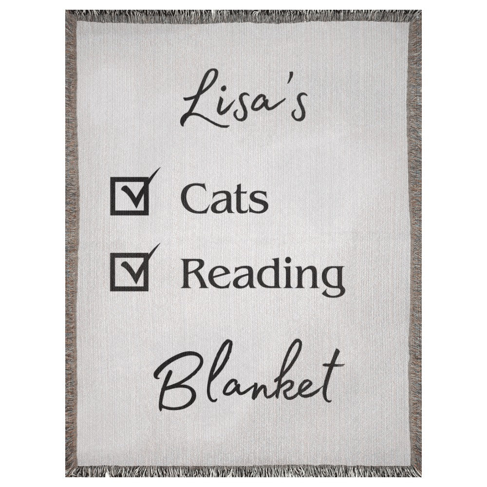 A personalized woven blanket with a name and checklist. This example says "Lisa's Cats Reading Blanket". 