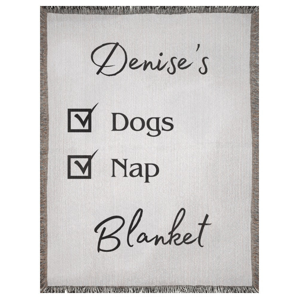 A personalized woven blanket with a name and checklist. This example says "Denise's Dogs Nap Blanket". 