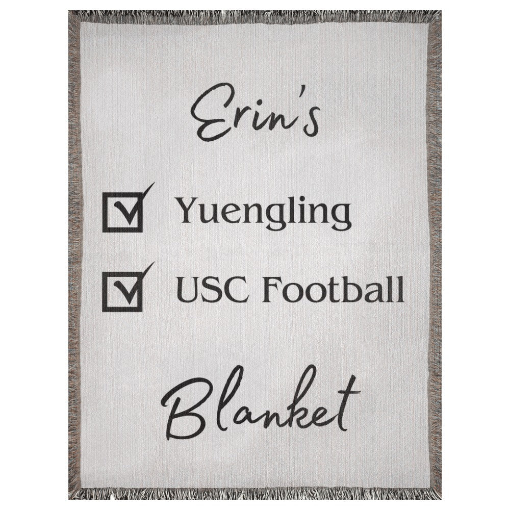 A personalized woven blanket with a name and checklist. This example says "Erin's Yuengling USC Football Blanket". 